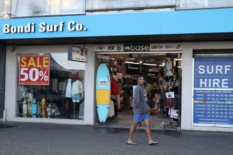 A man walks past a retail shop amidst the easing of the coronavirus disease (COVID-19) restrictions at Bondi Beach in Sydney, Australia, May 27, 2020. 