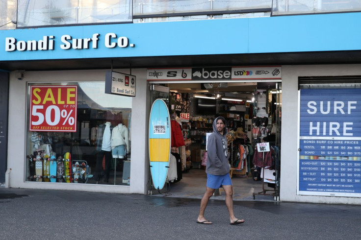 A man walks past a retail shop amidst the easing of the coronavirus disease (COVID-19) restrictions at Bondi Beach in Sydney, Australia, May 27, 2020. 