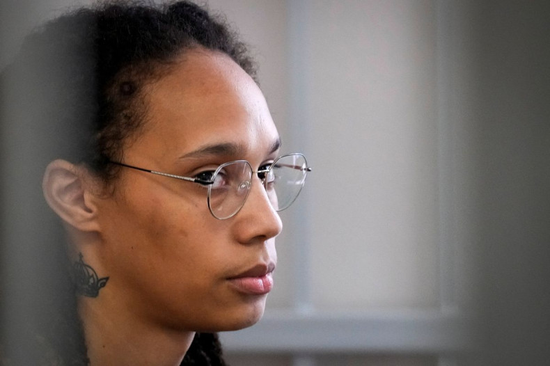 WNBA star and two-time Olympic gold medalist Brittney Griner sits in a cage at a court room prior to a hearing, in Khimki, outside Moscow, Russia, July 27, 2022.  Alexander Zemlianichenko/Pool via REUTERS