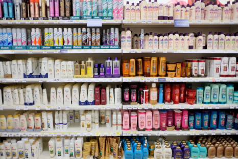 Bottles of shampoos are displayed for sale on shelves at a Tesco supermarket in south London, Britain, October 9, 2017. 