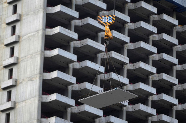 A crane is pictured during the construction of a building, in Shanghai, China July 20, 2022.