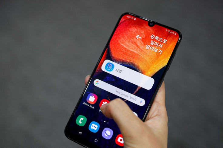 A woman tries out a Samsung Electronic's Galaxy A50 at a Samsung store in Seoul, South Korea, November 14, 2019. November 14, 2019. 