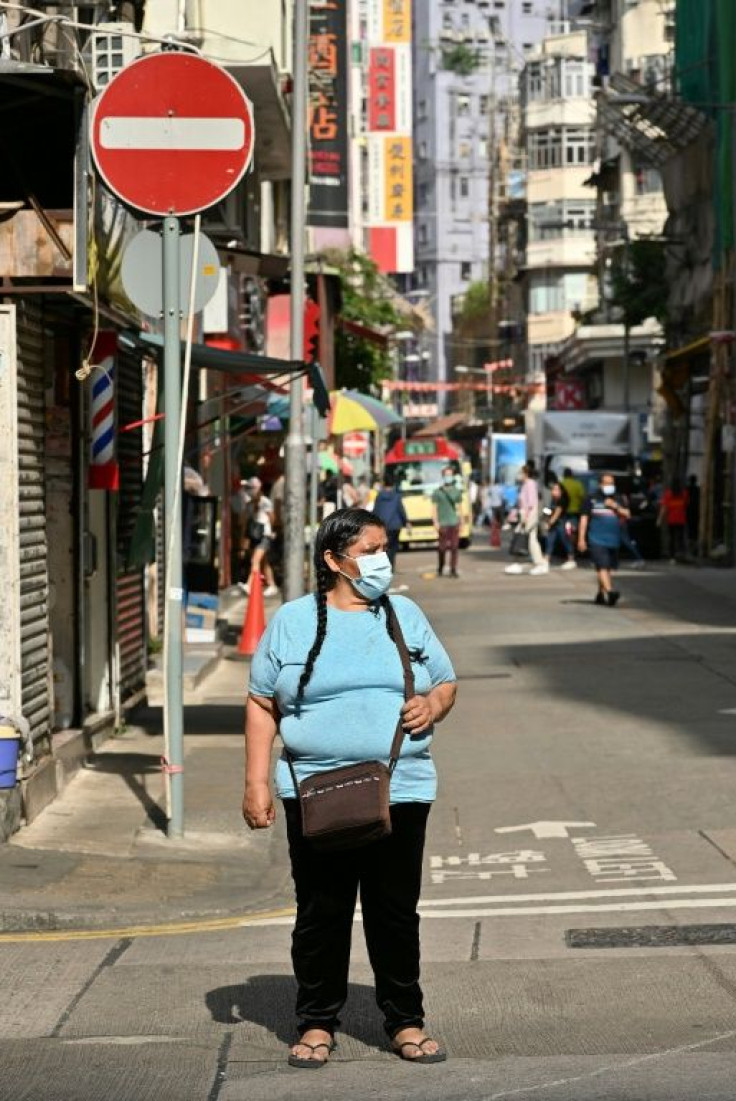 Zoila Lecarnaque Saavedra walks in the Jordan area of Hong Kong near the cramped hostel where she lived after her recent release