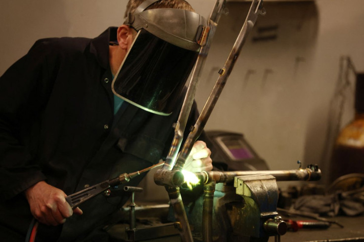 A worker assembles a new bike frame at the Pashley bicycle factory in Stratford-upon-Avon, Britain, June 30, 2022. 