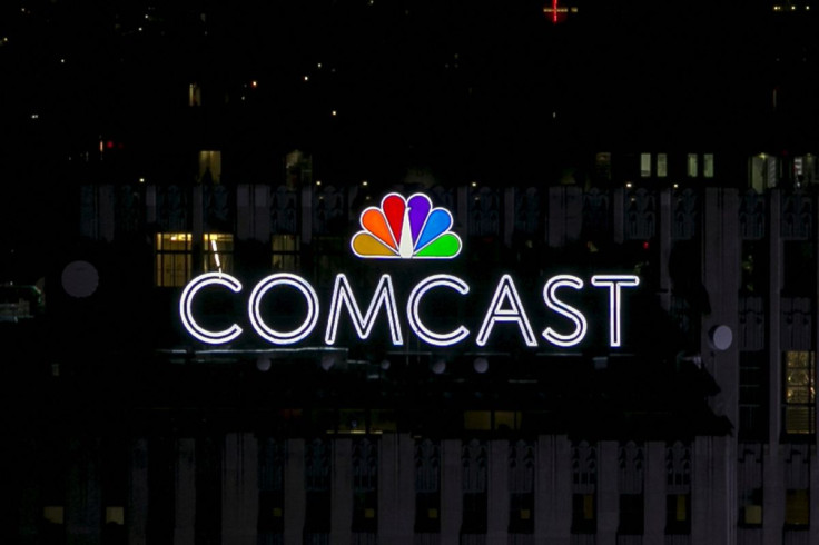 The NBC and Comcast logo are displayed on top of 30 Rockefeller Plaza, formerly known as the GE building, in midtown Manhattan in New York July 1, 2015.  