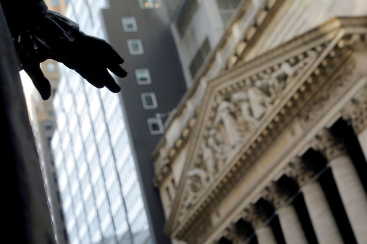 The hand of a sculpture of former U.S. President George Washington is pictured with the facade of the New York Stock Exchange (NYSE) in Manhattan in New York City, New York, U.S., January 28, 2021. 