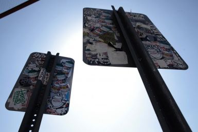 Defaced road signs are seen outside the 'Art In The Streets' exhibit