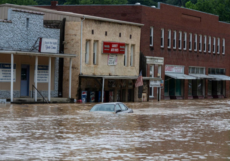 A car is submerged in flood waters along Right Beaver Creek, following a day of heavy rain in in Garrett, Kentucky, U.S. July 28, 2022.  Pat McDonogh/USA TODAY NETWORK via REUTERS