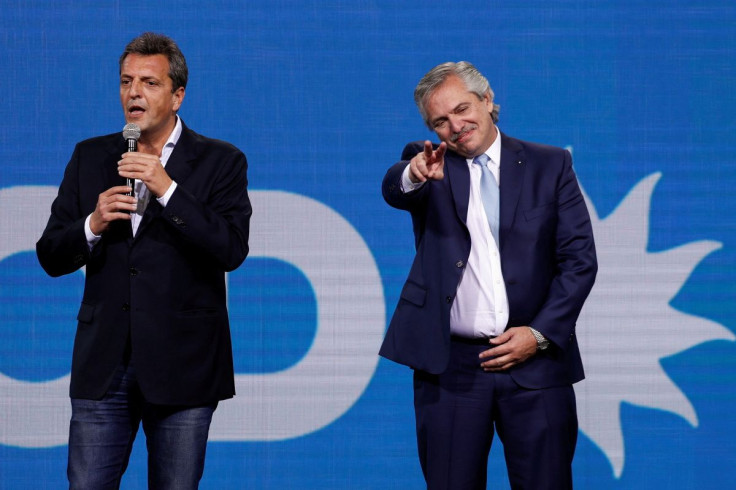 Sergio Massa, President of the Chamber of Deputies, addresses the audience as Argentina's President Alberto Fernandez gestures during an event after midterm elections in Buenos Aires, Argentina, November 14, 2021.