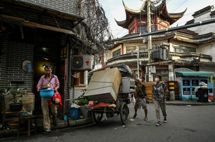 Antique dealers have been busily buying up furniture and other household items sold by departing Laoximen residents