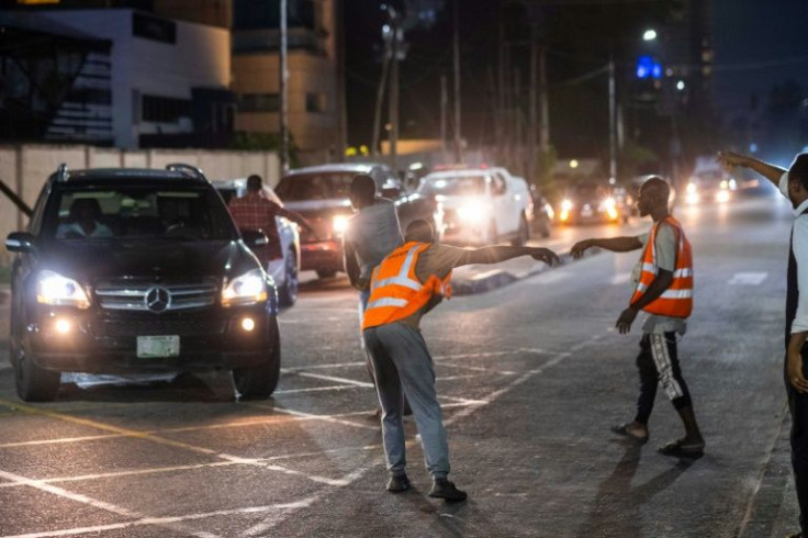 In the wealthy Ikoyi neighbourhood, the flow of people chasing money never stops