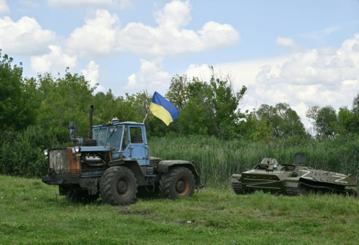 Farmers in northeast Ukraine reenact how they towed a captured Russian armoured vehicle