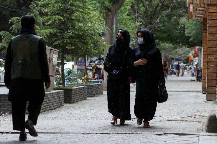 Afghan women walk on a street in Kabul, Afghanistan, May 9, 2022. 
