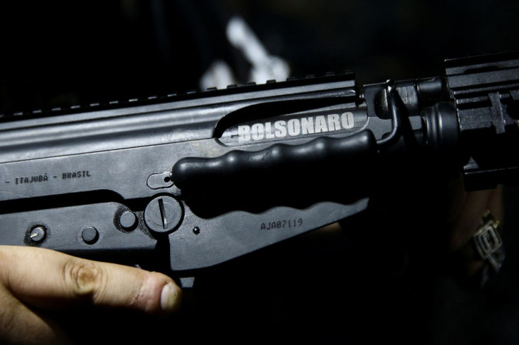 G16 shooting club president Gustavo Pazzini, holds a rifle which has a painting of the name of the Brazilian President Jair Bolsonaro during a practice session in Sao Paulo, Brazil July 28, 2022.