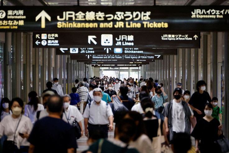 Passengers and passersby wearing protective face masks walk on the concourse, amid the coronavirus disease (COVID-19) pandemic, at Nagoya station in Nagoya, Japan, July 21, 2022.