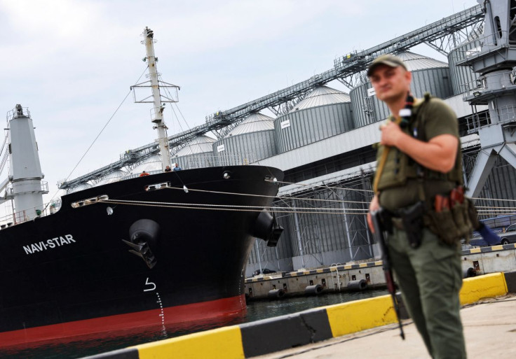 A Ukrainian serviceman stands in front of silos of grain from Odesa Black Sea port, before the shipment of grain as the government of Ukraine awaits signal from UN and Turkey to start grain shipments, amid Russia's invasion of Ukraine, in Odesa, Ukraine J