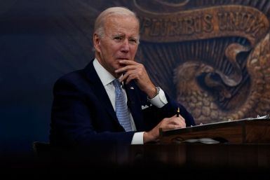 U.S. President Joe Biden listens as he receives an update on economic conditions from his advisors in the Eisenhower Executive Office Building's South Court Auditorium at the White House in Washington, U.S., July 28, 2022. 