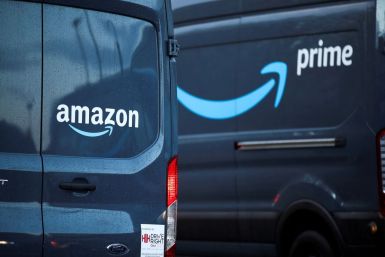 Logos of Amazon and Amazon Prime are pictured on vehicles outside the Amazon Fulfilment Centre in Altrincham, near Manchester, Britain, November 26, 2021. 