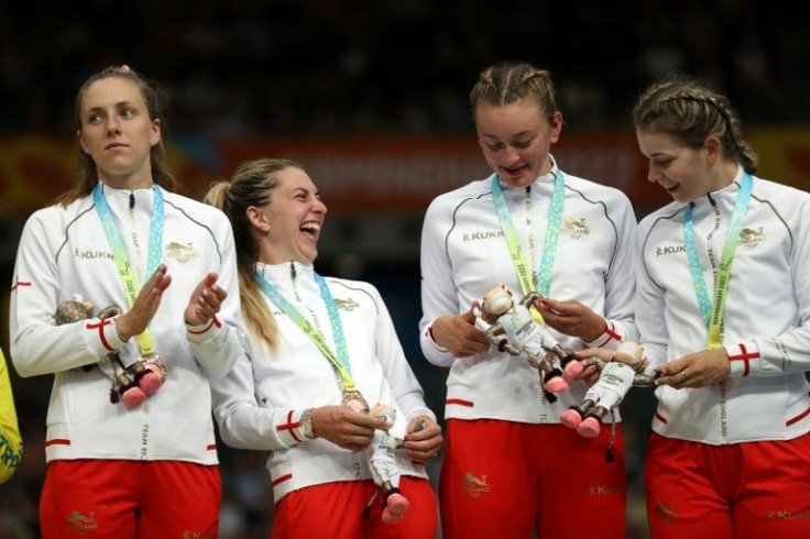 'Pressure': England's Laura Kenny (second left) and teammates celebrate with their bronze medals after the 4,000m team pursuit