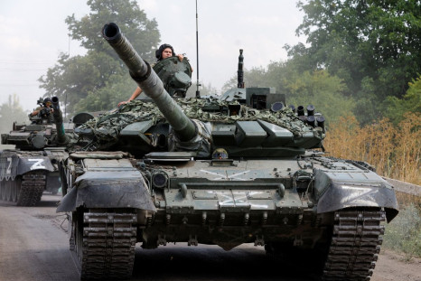Service members of pro-Russian troops drive tanks in the course of Ukraine-Russia conflict near the settlement of Olenivka in the Donetsk region, Ukraine July 29, 2022. 