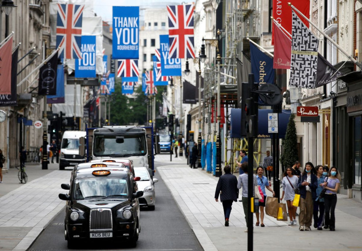 People walk along New Bond Street in London, Britain, June 15, 2020. 