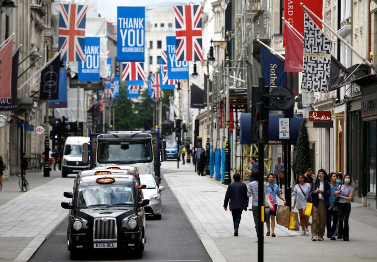 People walk along New Bond Street in London, Britain, June 15, 2020.
