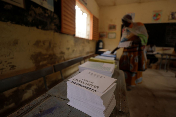 A woman prepares to cast her ballot during the parliamentary election at a polling station in Pikine, on the outskirts of Dakar, Senegal, July 31, 2022.