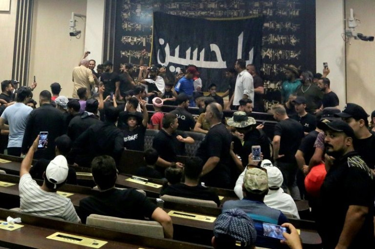 Followers of mercurial Iraqi cleric Moqtada continued their sit-in at parliament on Sunday, as the preacher called on other factions to support his protest initiative