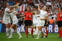 Champions: England players celebrate victory