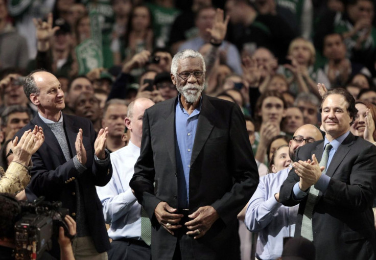 Boston Celtics great Bill Russell is applauded during the first half of the Celtics NBA basketball game against the Detroit Pistons in Boston, Massachusetts February 15, 2012.  The Bill Russell Mentoring Grant program was honored during the game.  