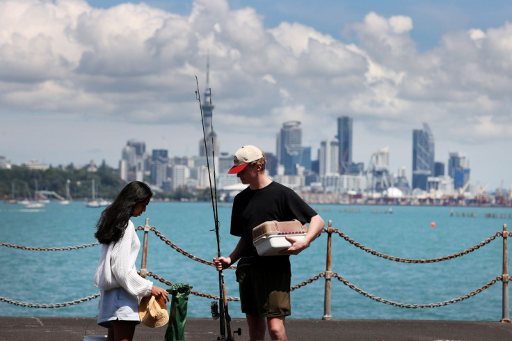 FILE PHOTO - People prepare to go fishing from the Orakei Wharf as coronavirus disease (COVID-19) lockdown restrictions are eased in Auckland, New Zealand, November 10, 2021.  