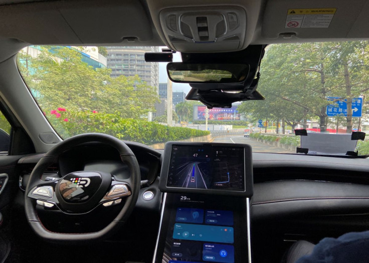 A safety driver sits on the passenger seat as the car with autonomous driving system by DeepRoute.ai, drives itself on a street in Shenzhen, Guangdong province, China July 29, 2022.