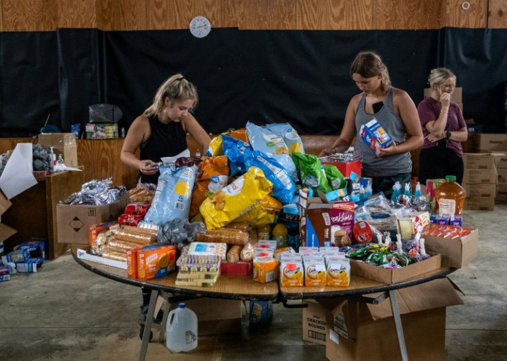 Volunteers work at a distribution center of donated goods on July 31, 2022 in Buckhorn, Kentucky, following historic flooding