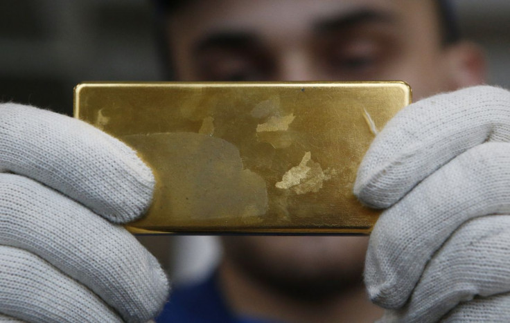 An employee shows gold bar at the Prioksky Non-Ferrous Metals Plant in Kasimov, Russia February 14, 2017. Picture taken February 14, 2017.