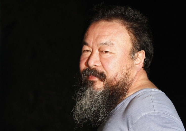 Dissident Chinese artist Ai Weiwei stands in the entrance of his studio after being released on bail in Beijing