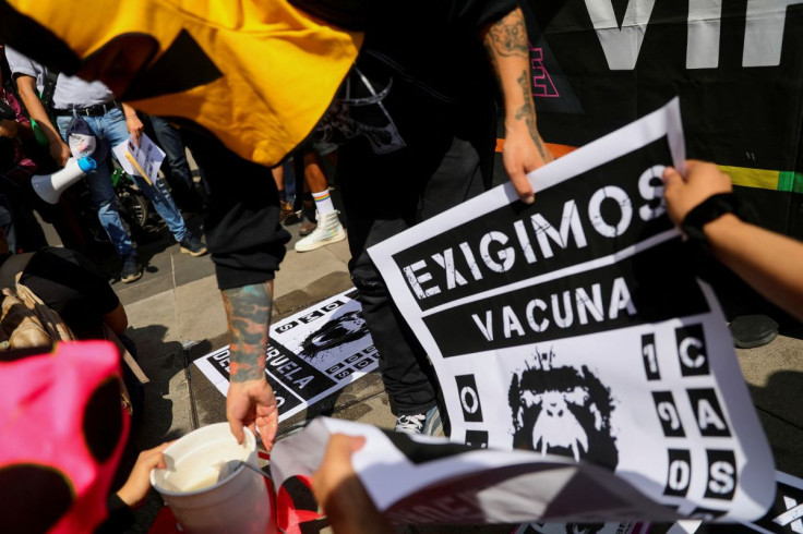 Activists hold posters during a protest to call for a stronger response by the government to the monkeypox crisis, outside the Health Secretary building, in Mexico City, Mexico, Mexico, July 26, 2022.