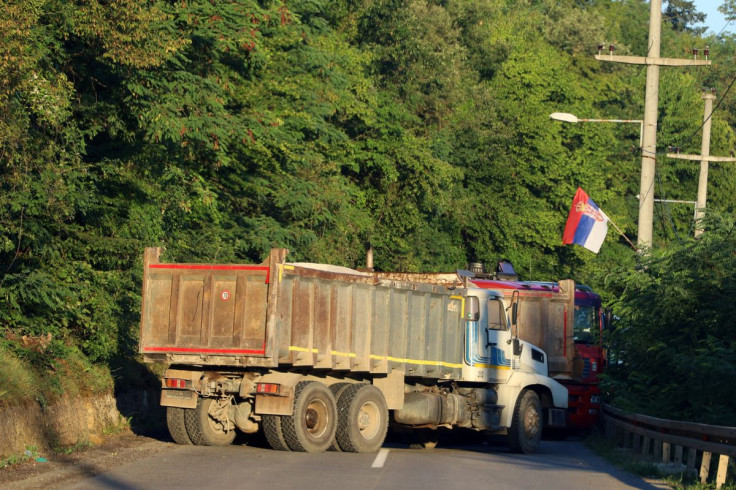A Serbian flag is seen as trucks block a road in Zupce, Kosovo August 1, 2022. 
