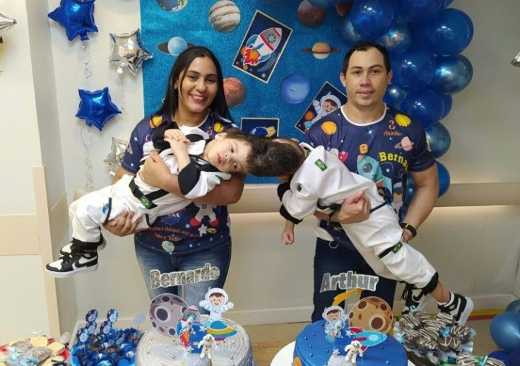 Brazilian conjoined twins Bernardo (L) and Arthur with their parents Adriely (L, back) and Antonio Lima, in Brazil: the twins were born with a single, shared brain have been separated in a complex surgery that doctors prepared for with the help of virtual