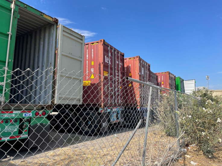 Containers stored on a lot are seen among warehouses in Fontana, California, U.S., July 17, 2022. 