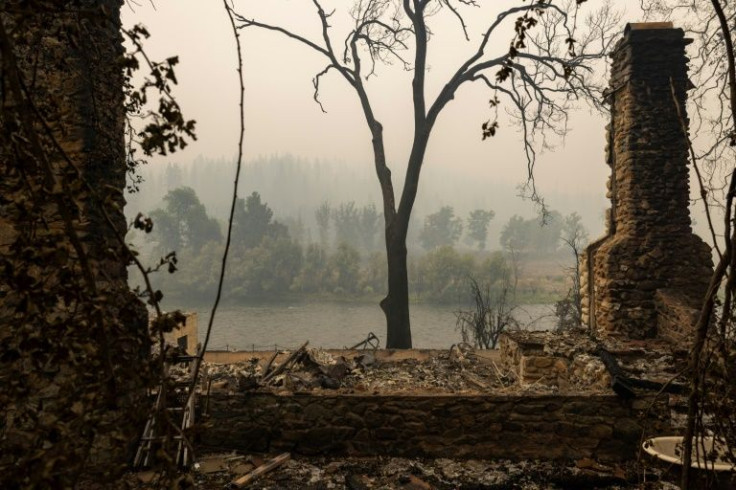 A chimney is all that remains of a river-front home in Klamath River northwest of Yreka, California