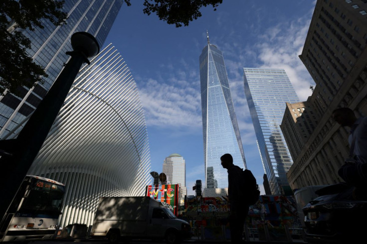 People walk by One World Trade Center after US President Joe Biden confirmed the death of al Qaeda leader Ayman al-Zawahiri in Manhattan, New York City, U.S., August 2, 2022.