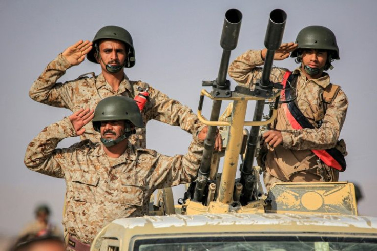 Yemeni pro-government forces take part in a parade in June: rival forces have been observing a fragile truce since April