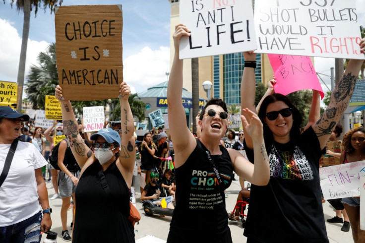 Abortion rights activists protest outside the venue of a summit by the conservative group 'Moms For Liberty' in Tampa, Florida, U.S. July 16, 2022.  