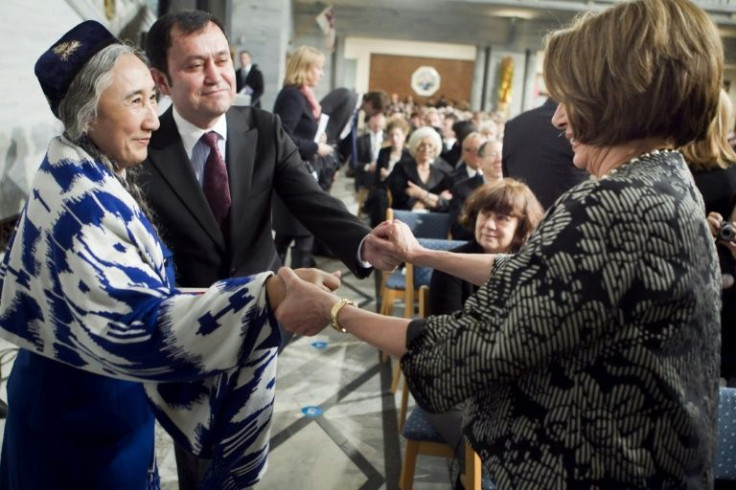 Then-US House of Representatives Democratic leader, Nancy Pelosi, (R) greets exiled Uyghur leader Rebiya Kadeer (L) and Alim Seytoff (2-L) , vice president of the Uyghur American Association, before the Nobel Peace Prize ceremony in Oslo in 2010