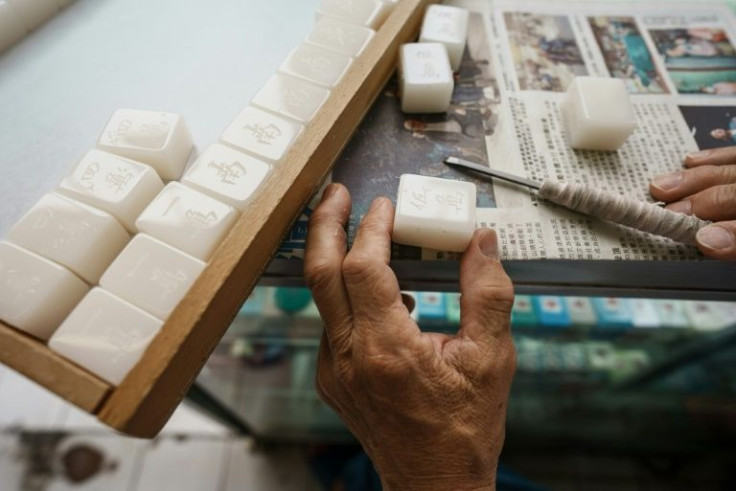Handcrafted mahjong tile sets cost more than twice as much as those carved by machines