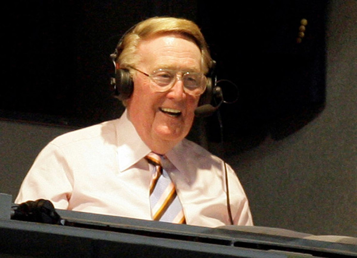 Los Angeles Dodgers announcer Vin Scully smiles in a broadcast booth during the National League MLB baseball game between the San Francisco Giants and the Los Angeles Dodgers in Los Angeles, April 25, 2007. 