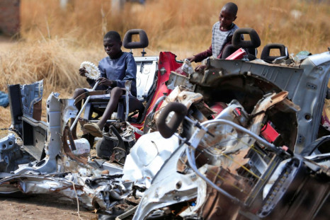 Kids play at a scrap metal collection point in Hopley, a poor settlement about 15 kilometres west of Zimbabwe's capital, Harare, Zimbabwe, July 22, 2022. 