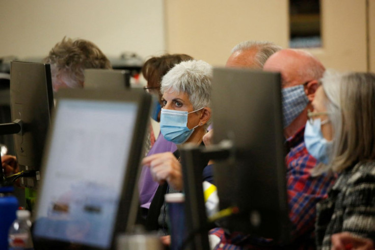 Election workers prepare ballots to be counted at the Maricopa County Tabulation and Election Center (MCTEC), days after former Vice President Joe Biden was declared the winner of the 2020 U.S. presidential election, in Phoenix, Arizona, U.S., November 9,