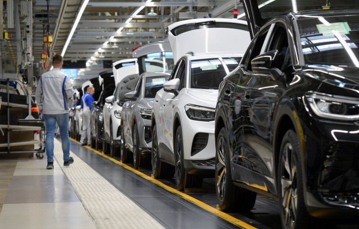 Technicians work at the production line for electric car models of the Volkswagen Group in Zwickau, Germany, April 26, 2022.