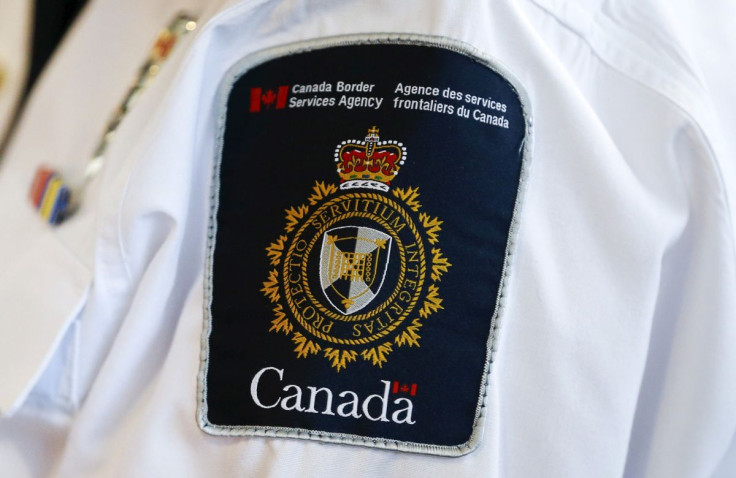 A Canada Border Services Agency (CBSA) logo is seen on a worker in Mississauga, Ontario, December 8, 2015. 
